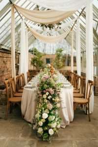 YES Hire's oak cross back chairs and oval table are used as part of a photo shoot at Hutton Wandesley Stables