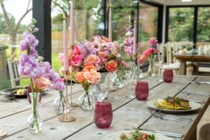 YES Hire's pink glasses on the table at the Forge near York. Beautiful flowers on the table