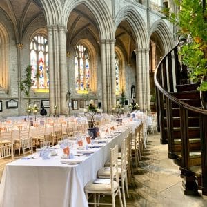 trestle tables, limewash chiavari chairs and white linen tablecloths hired for an event in Ripon Cathedral