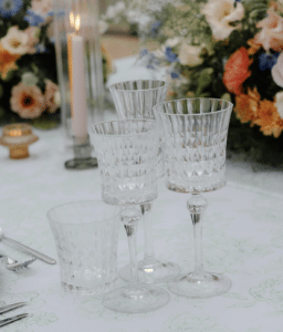 Four glasses set on a wedding table - these are the Lady Diamond glasses by YES hire. Crystal fancy glassware hire in Yorkshire