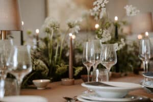 A full setting of YES Hire's Symetrie glass range sits on a fully set table. The picture was taken at a wedding themed photoshoot in Denten Rserve North Yorkshire