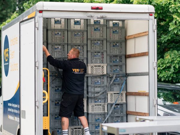 YES Hire staff unloading glasses for hire from a van